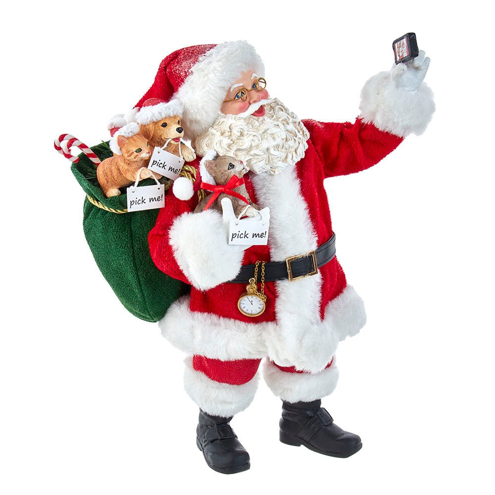 Holiday decoration featuring Fabriché™ Selfie Santa, 11 Inches