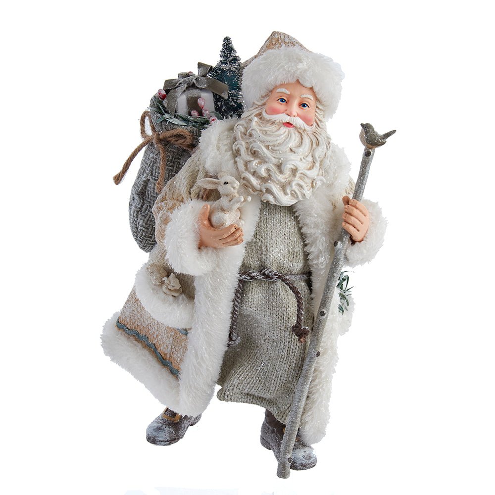 Holiday decoration featuring Fabriché™ Snowy Woods Santa, 10.5 inches