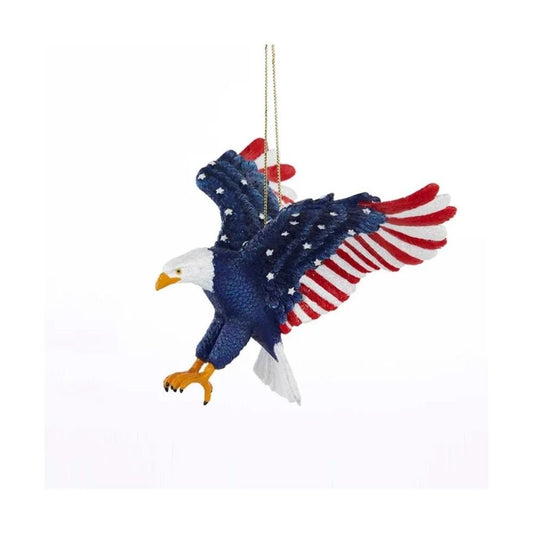 Patriotic eagle ornament holding flag in claws, stars on wings, red-white-blue